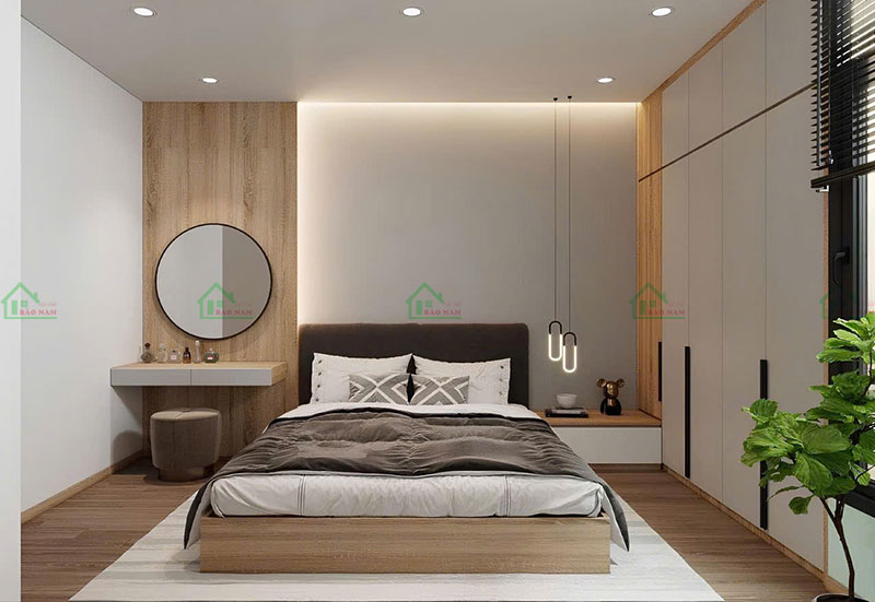 Phòng ngủ được tối ưu hóa không gian với nội thất thông minh, sử dụng vật liệu gỗ tự nhiên và ánh sáng ấm áp, tạo cảm giác thư giãn.